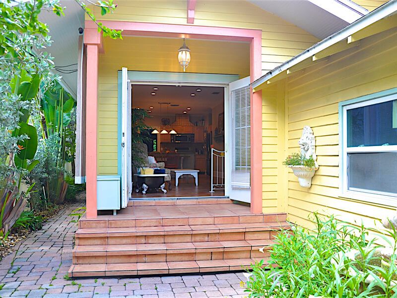 Double French doors open to the back courtyard